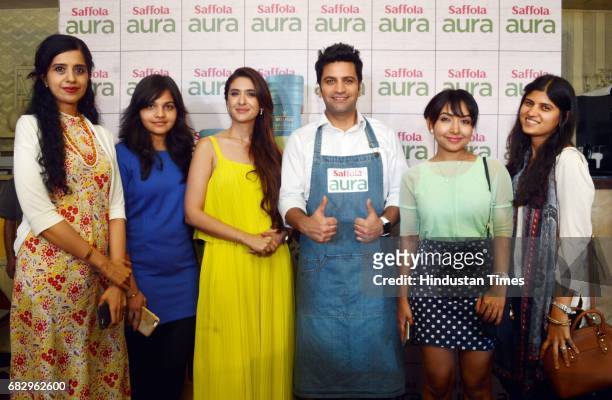 Chef Kunal Kapur and celebrity nutritionist Pooja Makhija during the launch of Saffola Aura - the new Super Oil with Olive Oil and Flaxseed Oil, at...