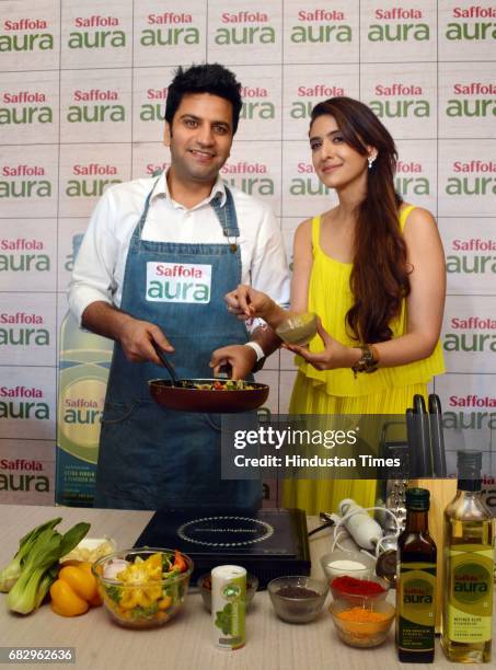 Chef Kunal Kapur and celebrity nutritionist Pooja Makhija during the launch of Saffola Aura - the new Super Oil with Olive Oil and Flaxseed Oil, at...