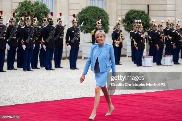 First Lady Brigitte Trogneux arrives ten minutes before her husband, the new French President elected Emmanuel Macron to attend a formal ceremony as...