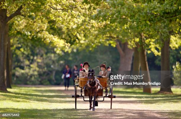 Two ladies seen carriage driving as they head to the start of The Champagne Laurent-Perrier Meet of the British Driving Society on day 5 of the Royal...
