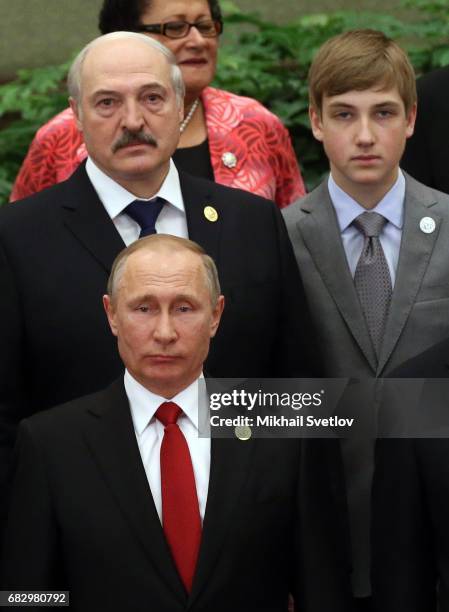 Russian President Vladimir Putin , Belarussian President Alexander Lukashenko and his son Nikolai Lukashenko pose for a photo prior to the dinner...