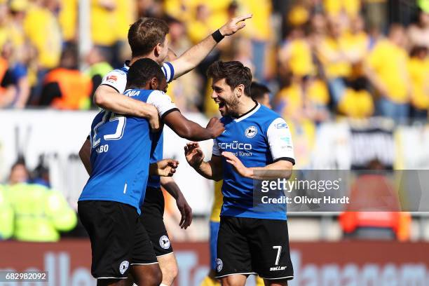 Reinhold Yabo of Bielefeld and his team mates Fabian Klos and Michael Goerlitz celebrates after scoring their third goal with his team mates during...