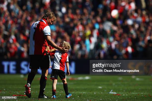 Captain, Dirk Kuyt of Feyenoord with his son celebrates infront of the fans after winning the Dutch Eredivisie at De Kuip or Stadion Feijenoord on...