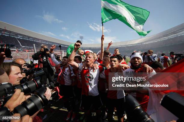 Captain, Dirk Kuyt of Feyenoord Rotterdam celebrates with team mates after winning the Dutch Eredivisie at De Kuip or Stadion Feijenoord on May 14,...