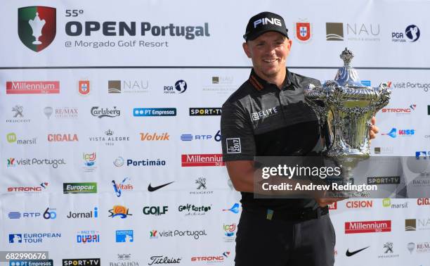 Matt Wallace of England celebrates victory with the trophy after the final round on day four of the Open de Portugal at Morgado Golf Resort on May...