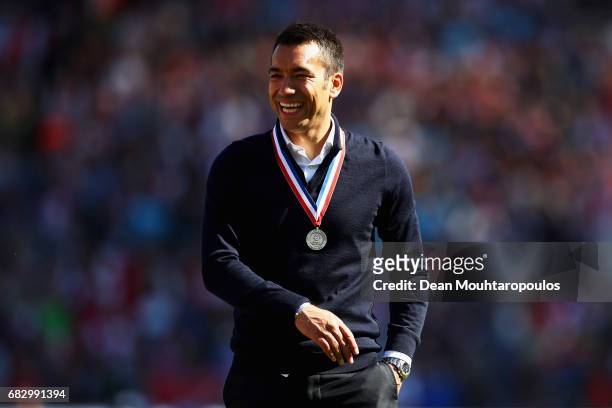 Manager / Head Coach, Giovanni van Bronckhorst celebrates in front of the home fans after winning the Dutch Eredivisie at De Kuip or Stadion...