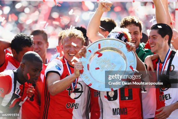 Captain, Dirk Kuyt of Feyenoord Rotterdam celebrates in front of the home fans by lifting the trophy for winning the Dutch Eredivisie at De Kuip or...