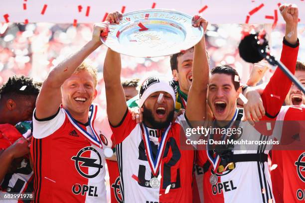 Captain, Dirk Kuyt of Feyenoord Rotterdam celebrates in front of the home fans by lifting the trophy for winning the Dutch Eredivisie at De Kuip or...