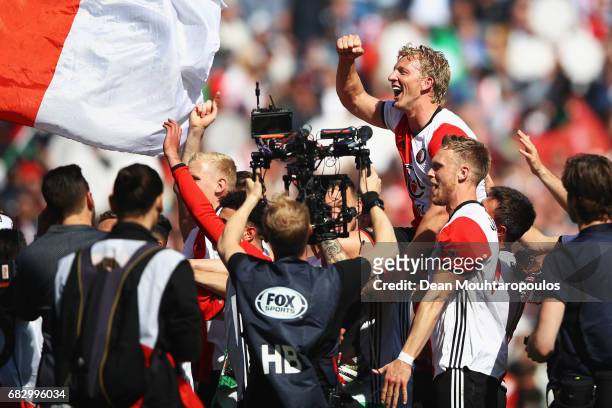 Captain, Dirk Kuyt of Feyenoord Rotterdam celebrates with team mates in front of the home fans after winning the Dutch Eredivisie at De Kuip or...