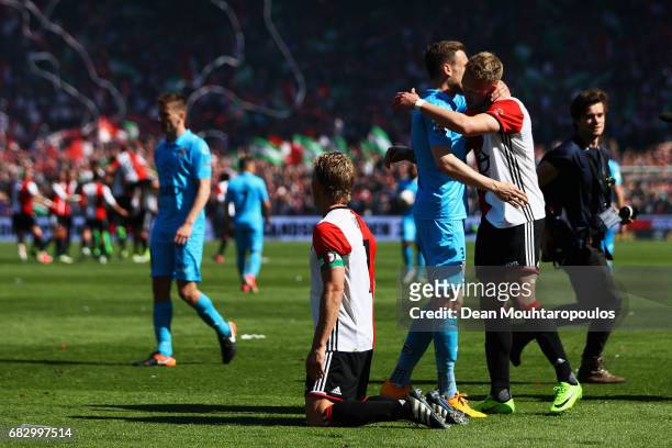 Captain, Dirk Kuyt of Feyenoord Rotterdam drops to his knees as he celebrates with team mates in front of the home fans after winning the Dutch...