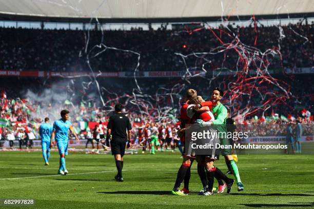 Captain, Dirk Kuyt of Feyenoord Rotterdam celebrates with team mates Brad Jones, Eljero Elia and Nicolai Jorgensen in front of the home fans after...