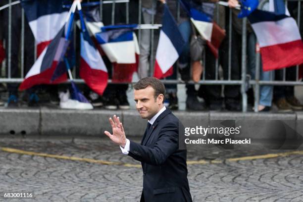 Newly-elected President Emmanuel Macron arrives on the Champs-Elysees avenue after the handover ceremony with France's outgoing President Francois...