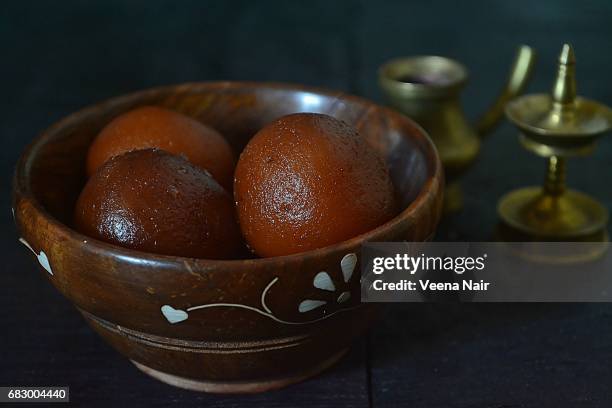 gulab jamun in a wooden bowl/indian dessert - gulab jamun stock pictures, royalty-free photos & images