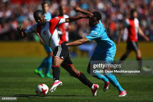 Miquel Nelom of Feyenoord Rotterdam battles for the ball with Brandley Kuwas of Heracles Almelo during the Dutch Eredivisie match between Feyenoord...