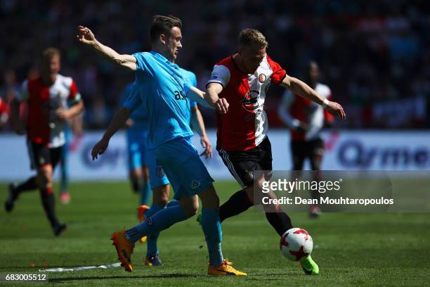 Mike te Wierik of Heracles Almelo battles for the ball with Jens Toornstra of Feyenoord Rotterdam during the Dutch Eredivisie match between Feyenoord...