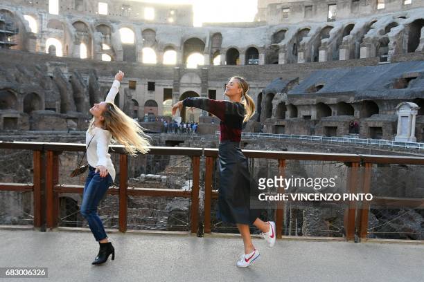 Russian tennis player Maria Sharapova jokes with an assistant at the Colosseum on May 14, 2017 in Rome. Five-time Grand Slam champion Maria Sharapova...