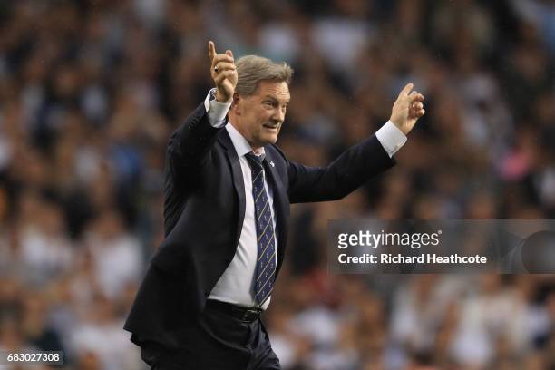 Former manager and player Glenn Hoddle salutes the crowd during the closing ceremony after the Premier League match between Tottenham Hotspur and...