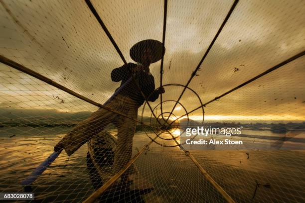 fisherman on inle lake - google social networking service stock pictures, royalty-free photos & images