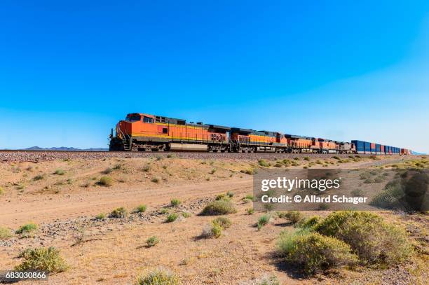 freight train driving through mojave desert california - train vehicle stock pictures, royalty-free photos & images