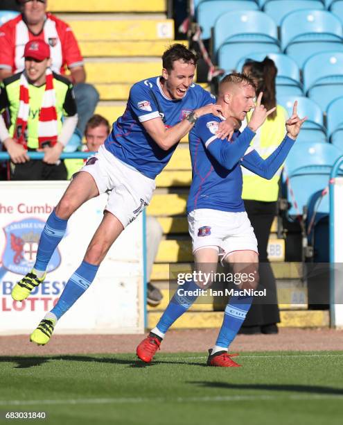 Jamie Devitt and Nicky Adams of Carlisle United celebrate their team's opening goal during the Sky Bet League Two match between Carlise United and...