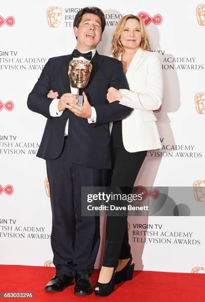 Michael McIntyre, winner of the Entertainment Performance award, and Kim Cattrall pose in the Winner's room at the Virgin TV BAFTA Television Awards...