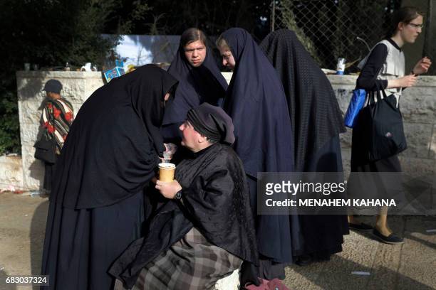 Ultra-Orthodox Jewish women known in Israel as "Neshot Ha Shalim", who cover themselves completely in a burqa-like head-to-toe black cloth, attend...