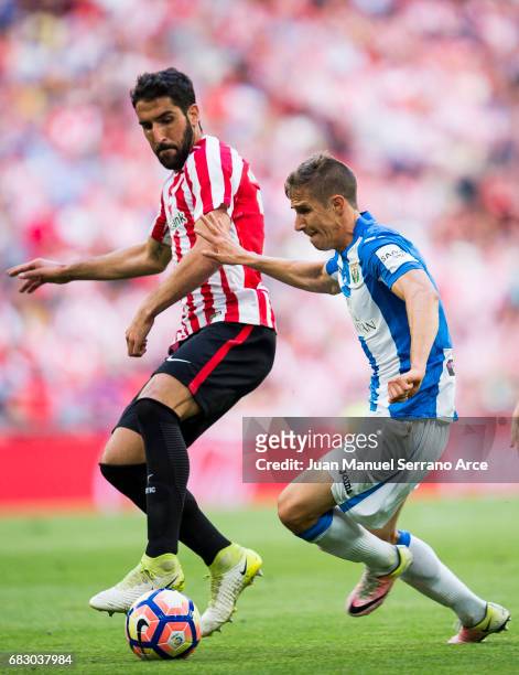 Alexander Szymanowski of Club Deportivo Leganes competes for the ball with Raul Garcia of Athletic Club during the La Liga match between Athletic...
