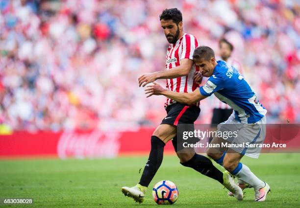 Alexander Szymanowski of Club Deportivo Leganes competes for the ball with Raul Garcia of Athletic Club during the La Liga match between Athletic...