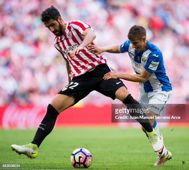 Alexander Szymanowski of Club Deportivo Leganes competes for the ball with Raul Garcia of Athletic Club during the La Liga match between Athletic...