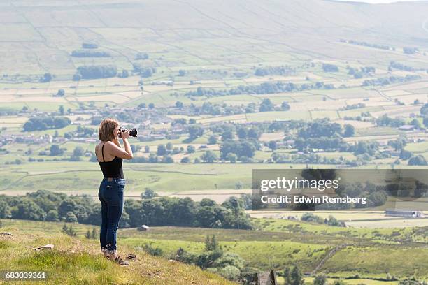 young girl photographing the dale - woman in spaghetti straps stock pictures, royalty-free photos & images