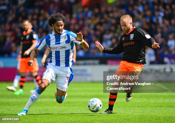 Huddersfield Town's Isaiah Brown vies for possession with Sheffield Wednesday's Barry Bannan during the Sky Bet Championship Play-Off Semi Final...