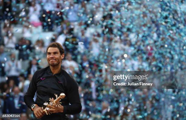 Rafael Nadal of Spain with the winners trophy after his win over Dominic Thiem of Austria in the final during day nine of the Mutua Madrid Open...