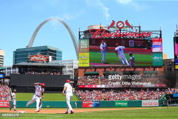 Yadier Molina of the St. Louis Cardinals rounds third base after hitting a two-run home run against the Chicago Cubs in the second inning at Busch...