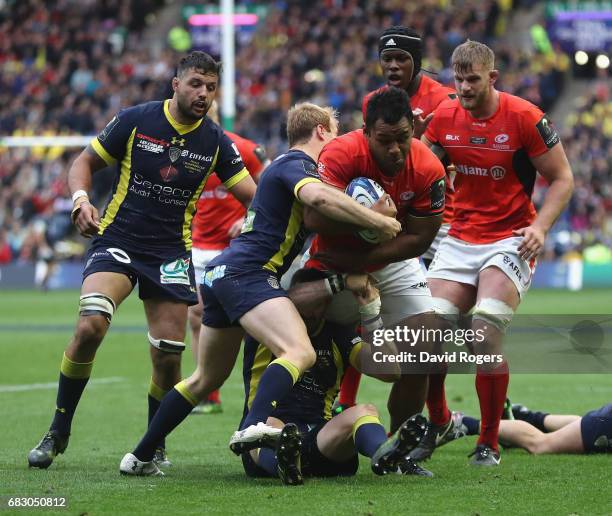 Billy Vunipola of Saracens is tackled by Nick Abendanon during the European Rugby Champions Cup Final between ASM Clermont Auvergen and Saracens at...