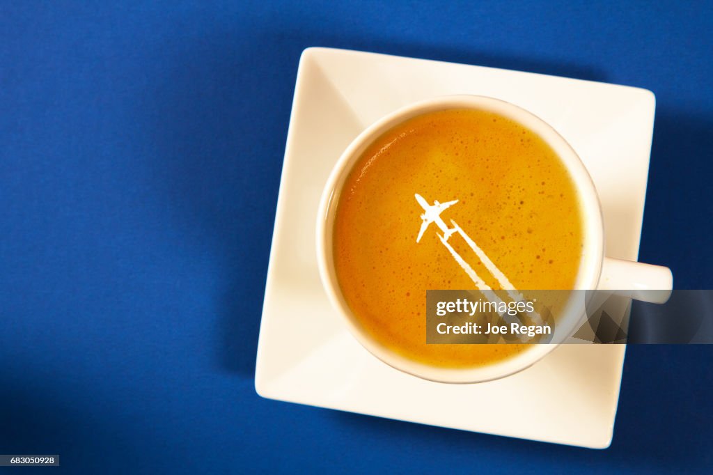 A cup of latte with decorated foam.
