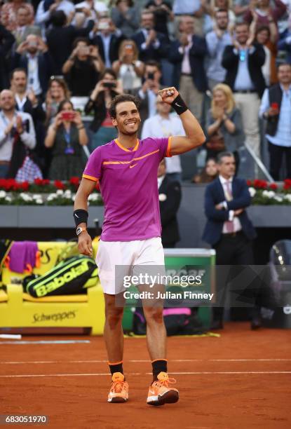 Rafael Nadal of Spain celebrates after winning at match point against Dominic Thiem of Austria in the final during day nine of the Mutua Madrid Open...