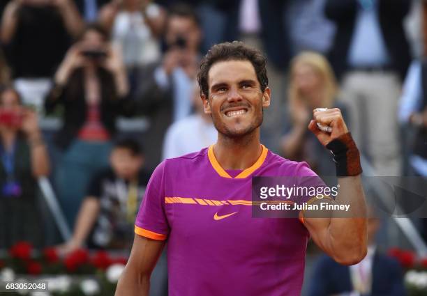 Rafael Nadal of Spain celebrates after winning at match point against Dominic Thiem of Austria in the final during day nine of the Mutua Madrid Open...