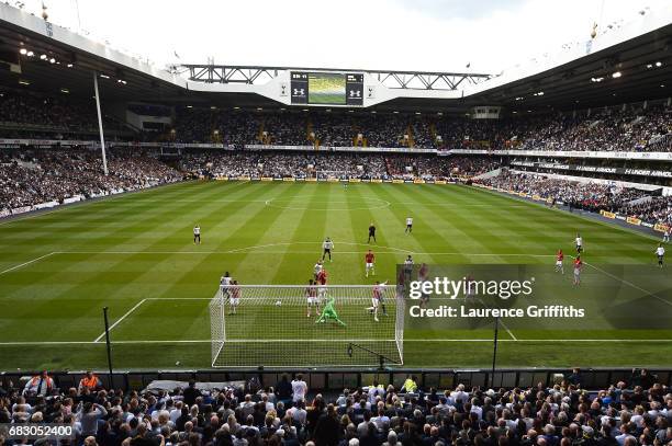 Harry Kane of Tottenham Hotspur scores his sides second goal past David De Gea of Manchester United during the Premier League match between Tottenham...