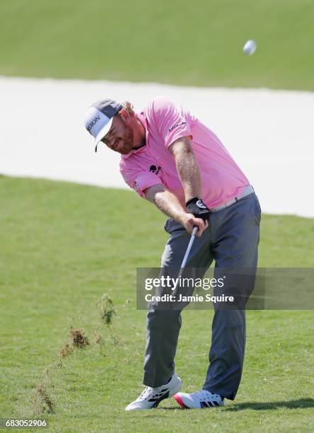 Holmes of the United States plays a shot on the fifth hole during the final round of THE PLAYERS Championship at the Stadium course at TPC Sawgrass...