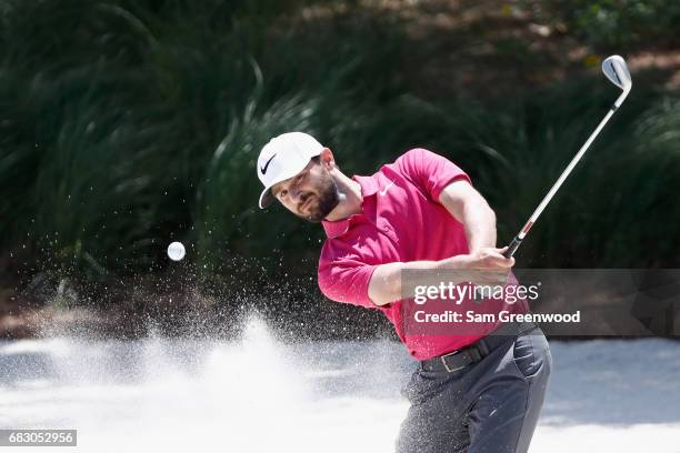 Kyle Stanley of the United States plays a shot from a bunker on the first hole during the final round of THE PLAYERS Championship at the Stadium...