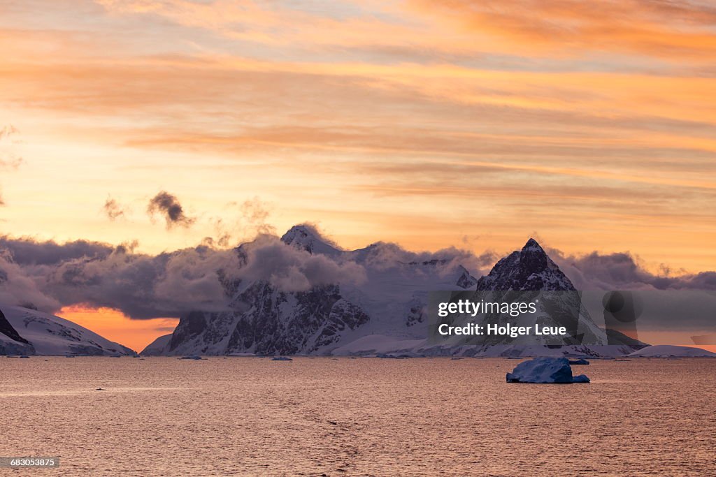 Snow-covered mountains at sunset