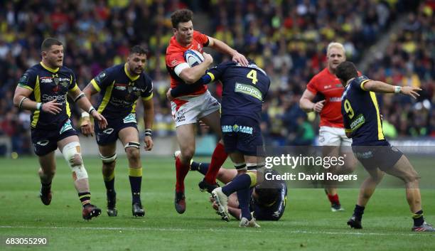 Duncan Taylor of Saracens is tackled by Arthur Iturria during the European Rugby Champions Cup Final between ASM Clermont Auvergen and Saracens at...