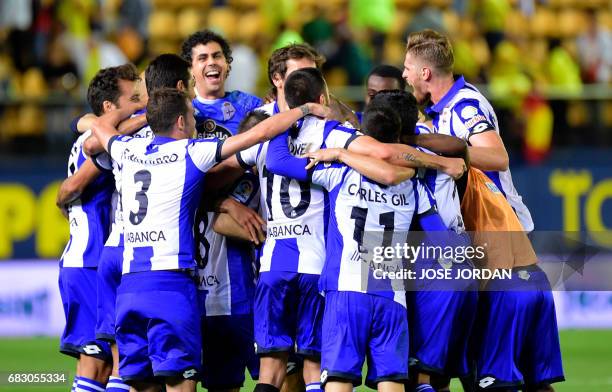 Deportivo La Coruna's players celebrate as they will keep playing in first division next season at the end of the Spanish league football match...