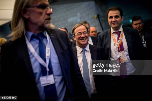 Armin Laschet, lead candidate of the German Christian Democrats , smiles while surrounded by security after CDU won the state elections in North...