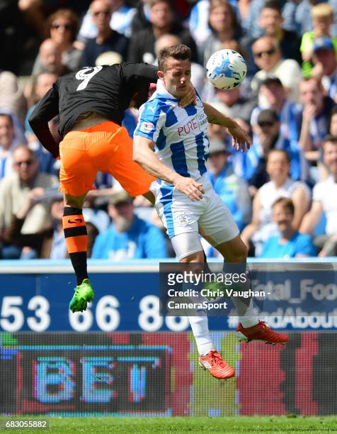 Sheffield Wednesday's Adam Reach vies for possession with Huddersfield Town's Jonathan Hogg during the Sky Bet Championship Play-Off Semi Final First...