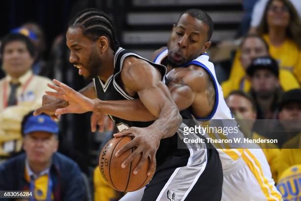 Andre Iguodala of the Golden State Warriors defends against Kawhi Leonard of the San Antonio Spurs during Game One of the NBA Western Conference...
