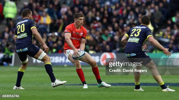 Owen Farrell of Saracens looks to pass the ball during the European Rugby Champions Cup Final between ASM Clermont Auvergen and Saracens at...
