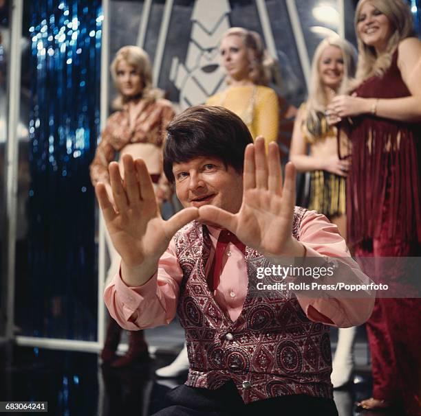 English comedian and actor, Benny Hill posed on set in a television studio in London in 1971.