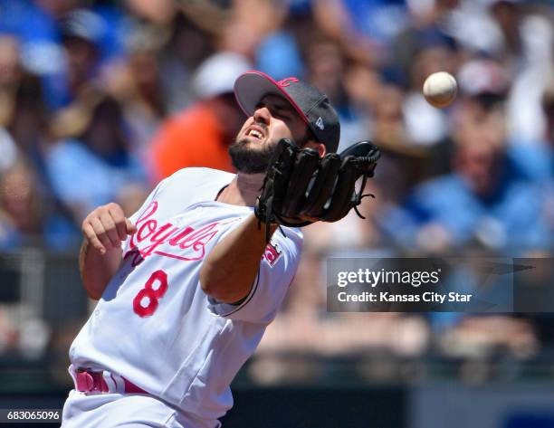 Kansas City Royals third baseman Mike Moustakas misses an infield fly for a single by Baltimore Orioles' Ryan Flaherty in the second inning on...