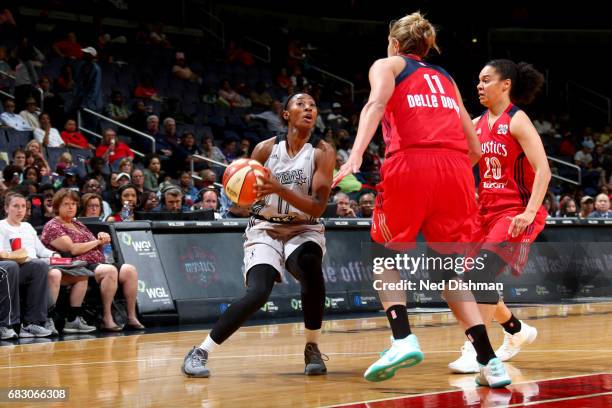 Clarissa dos Santos of the San Antonio Stars handles the ball against the Washington Mystics on May 14, 2017 at Verizon Center in Washington, DC....